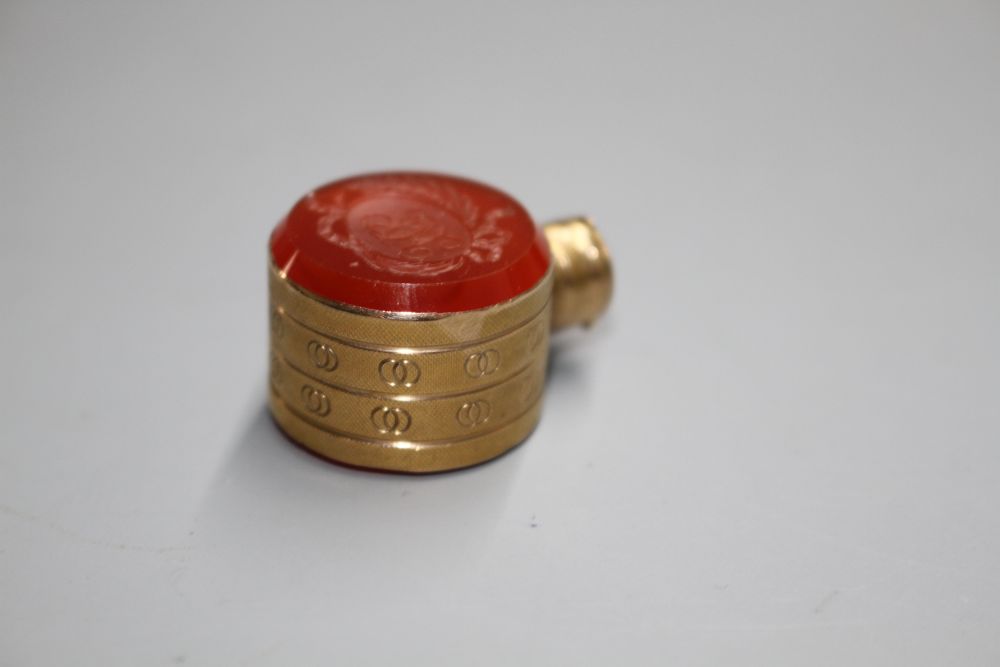 A small 19th century engraved gold and carnelian set moon shaped scent flask,